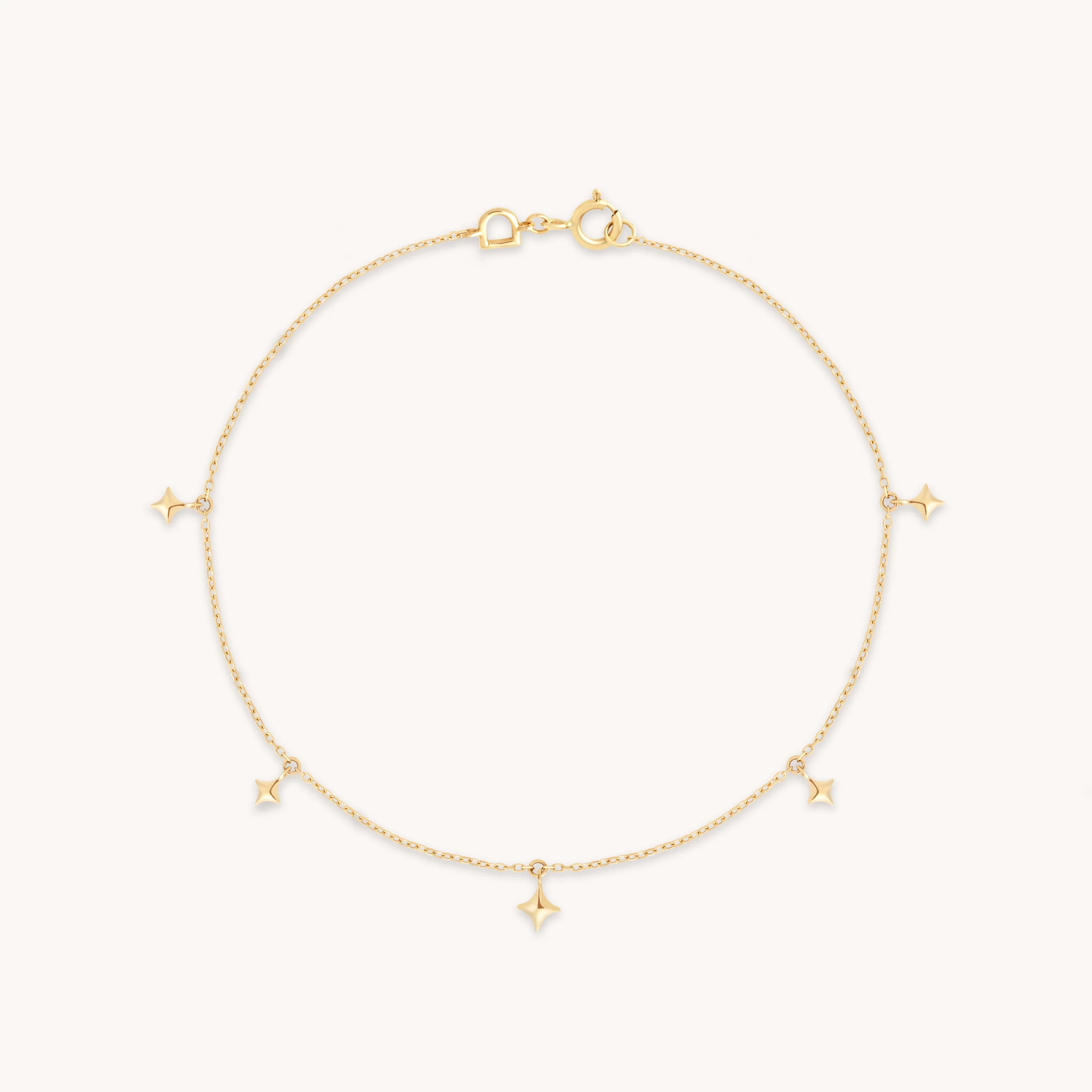 Cosmic Star Charm Bracelet in Solid Gold