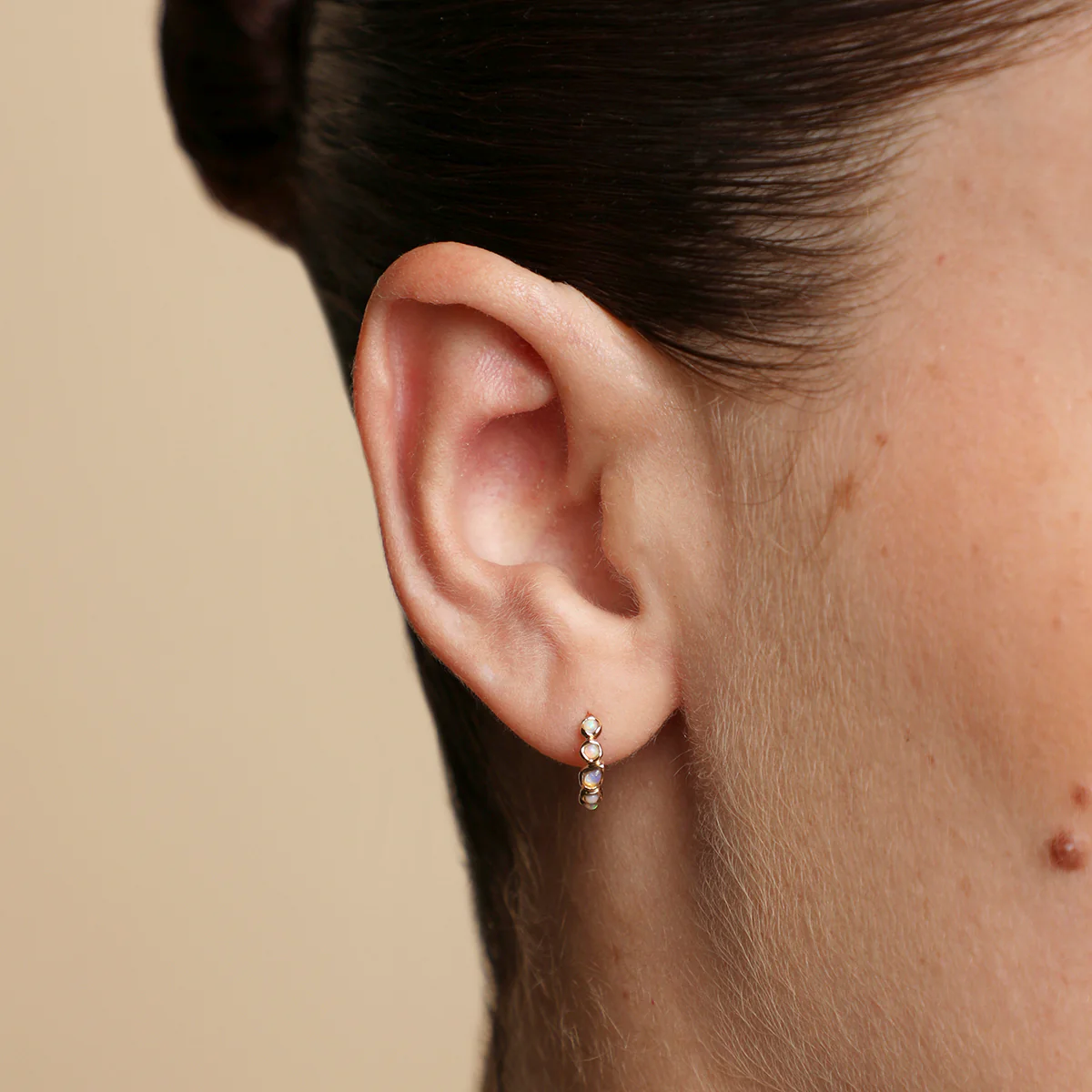 Opal Pear Bezel Huggies in Solid Gold - Image 2